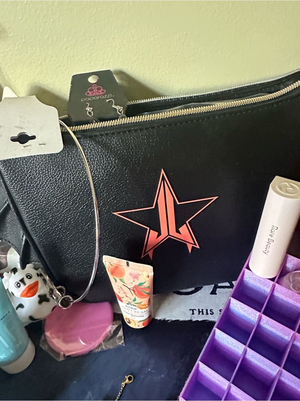 Jeffree Star Black Bat Pouch with Coral Pink Star Logo filled